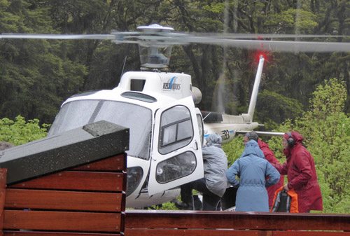 Group entering helicopter