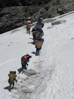 Porters start off on glacier