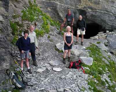 group posing outside cave